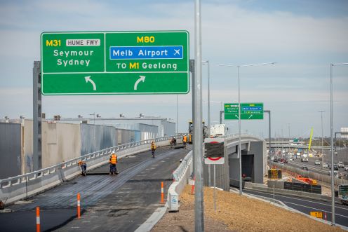 Taken from a distance. A number of people are working on an overpass on the Ring Road.