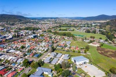 Aerial photo of a town with houses and grass